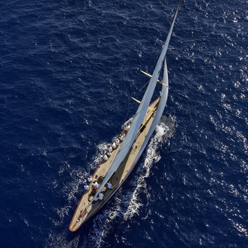Sailboat navigating open wThe Good Stress Guide: Why Not All Stress Is Bad by Blue Essentialsaters – a guide to understanding and managing stress for better health
