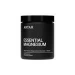 Black container of Artah Essential Magnesium on a white background