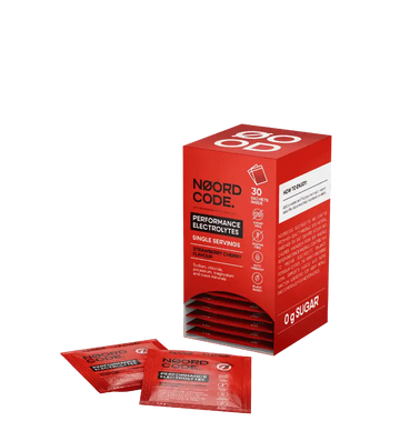 Red box and packets of Noord Code Performance Electrolytes on a white background