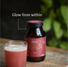 Ancient Brave Radiant Collagyn mixed into water glass on a wooden surface